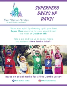 Five children in colorful superhero costumes pose outdoors with arms raised. Text promotes Superhero Dress Up Days at Muir Station Smiles, a fun kids dental event in Martinez, with a free Jamba Juice for social media posts.