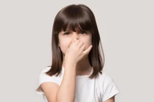 Kids with bad breath receiving dental care at Muir Station Smiles