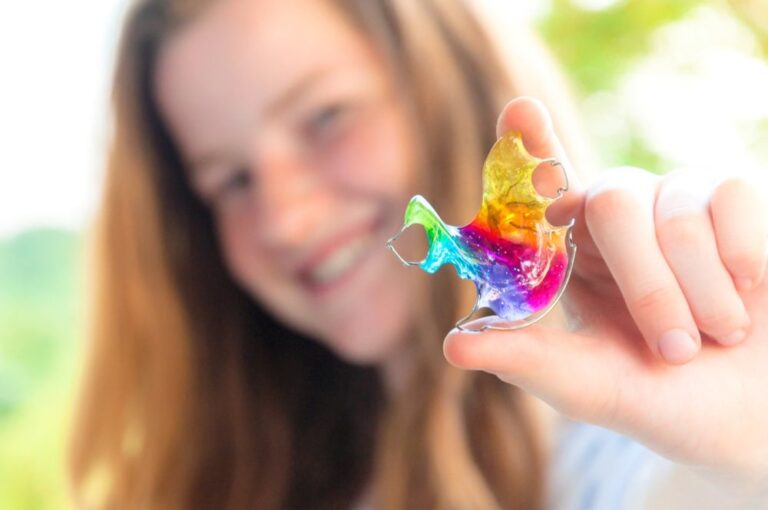 Colorful retainer held by girl