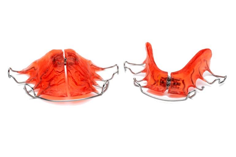 Red orthodontic retainers on display
